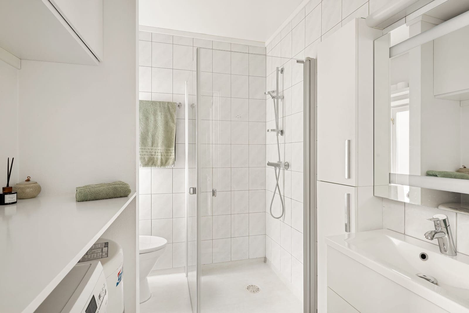A small, bright rented apartment bathroom